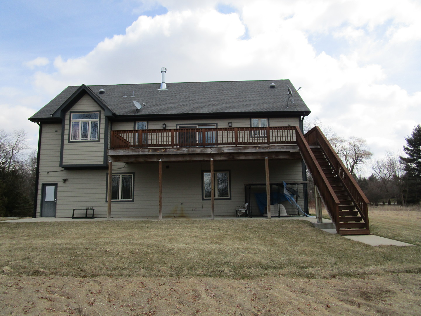 6909 Schultz Road Harvard, IL 60033 - Photo 6 of 19 a front view of a house with a garage