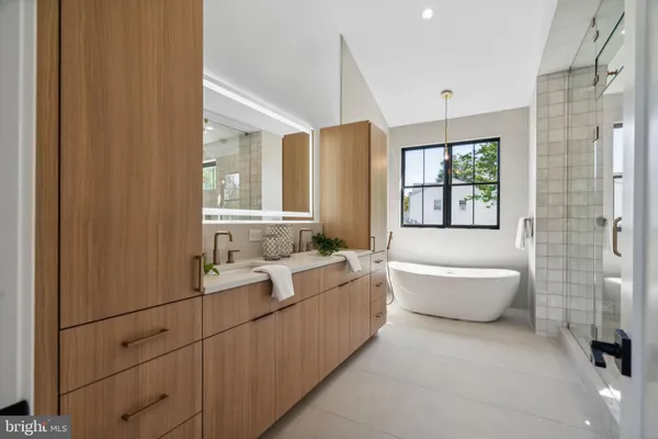 a bathroom with a glass shower door