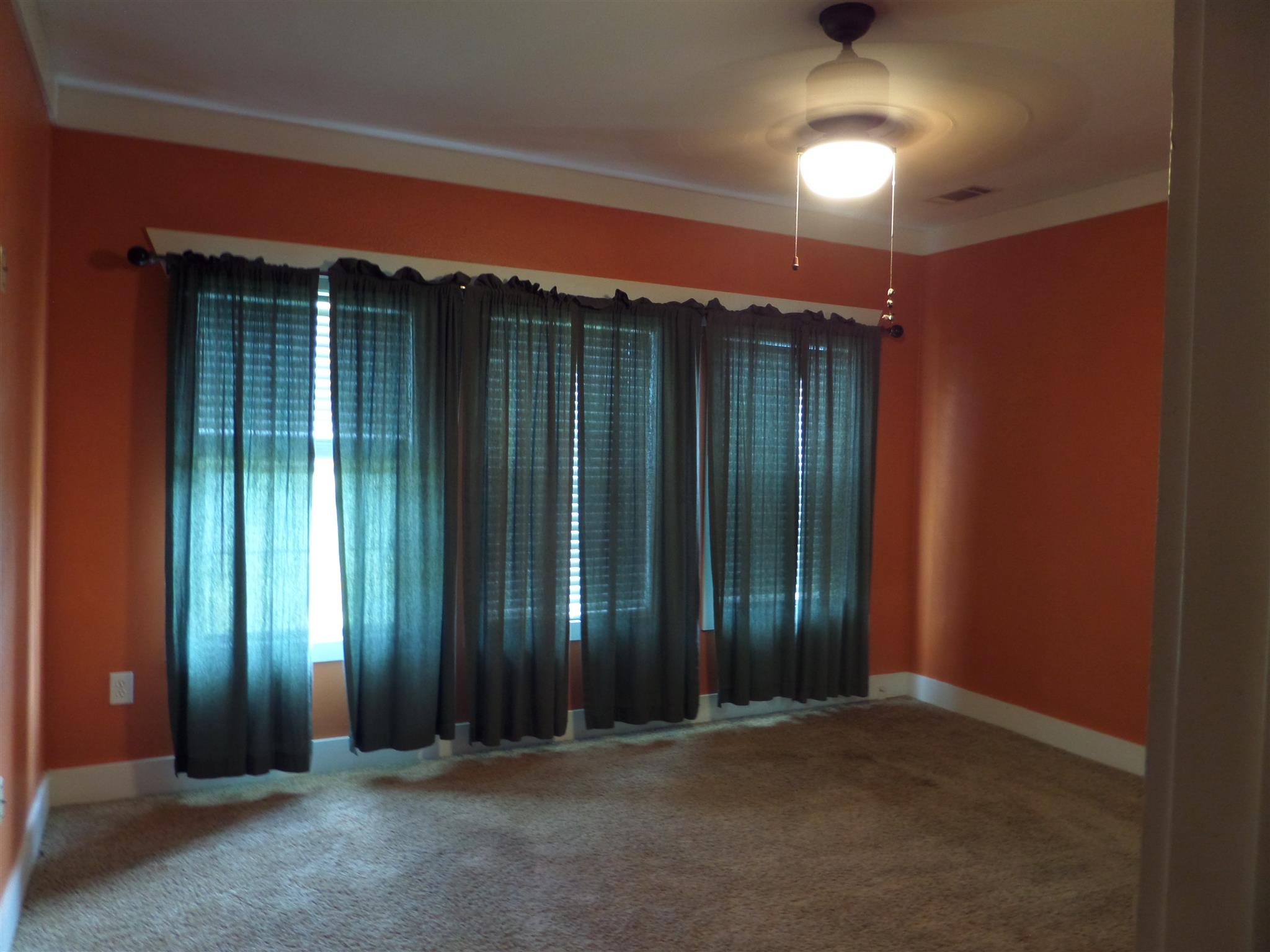 855 Cut Off Road Pulaski, TN 38478 - Photo 12 of 26 an empty room with stairs and windows