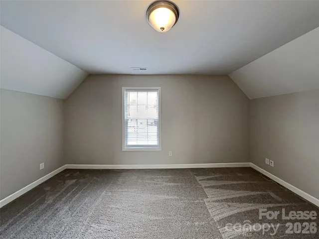 an empty room with a empty space and a window