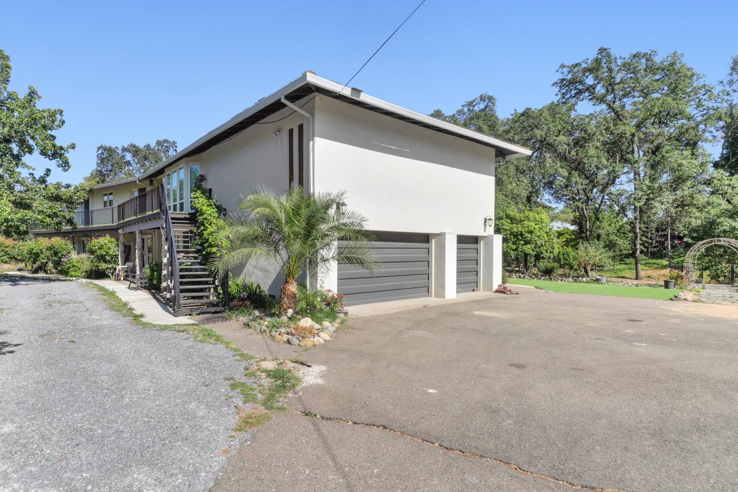 4330 Cavitt Stallman Road Granite Bay, CA 95746 - Photo 71 of 85 a view of a house with a yard and garage