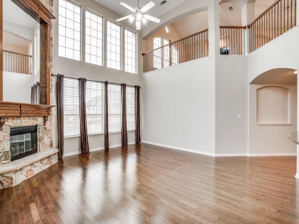 2613 Sandstone Lane Midlothian, TX 76065 - Photo 11 of 36 a view of an empty room with wooden floor and a window