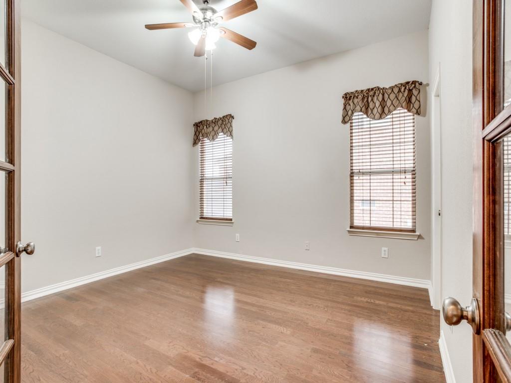 2613 Sandstone Lane Midlothian, TX 76065 - Photo 18 of 36 a view of an empty room with a window and wooden floor