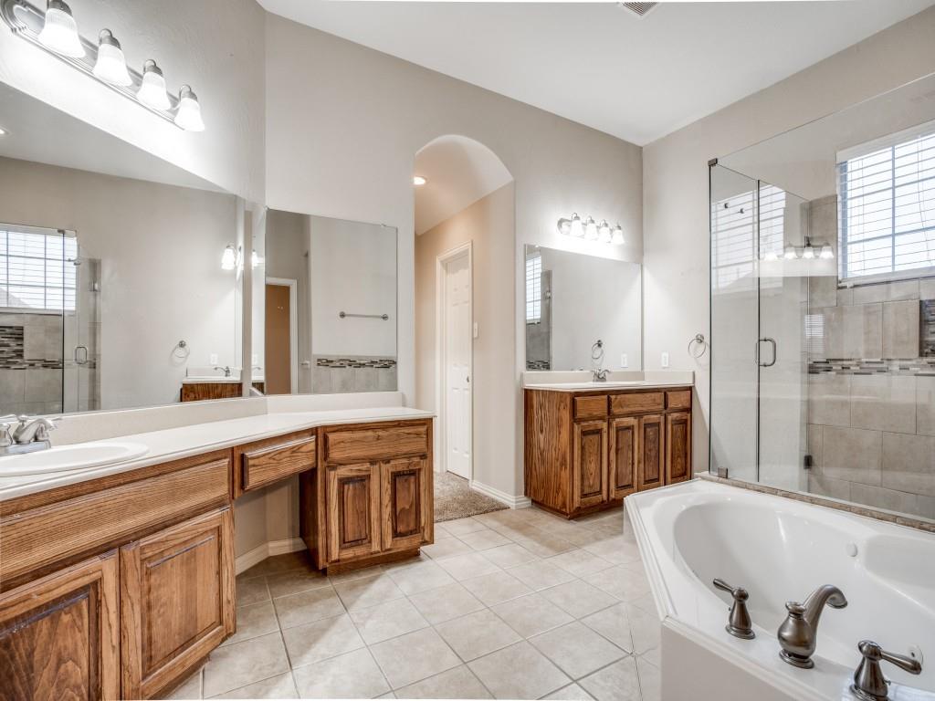 2613 Sandstone Lane Midlothian, TX 76065 - Photo 21 of 36 a large spacious bathroom with a large tub sink and double vanity