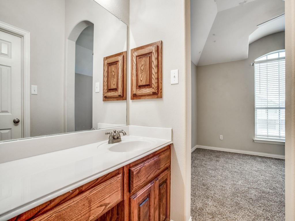 2613 Sandstone Lane Midlothian, TX 76065 - Photo 29 of 36 a bathroom with a sink a vanity and a mirror