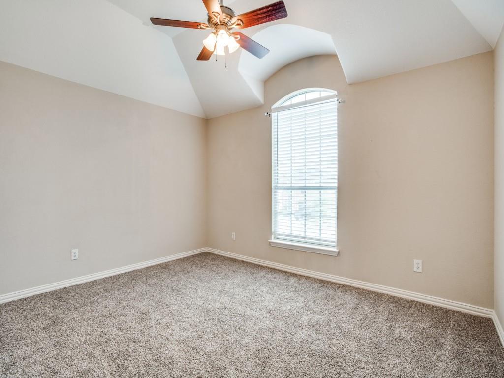 2613 Sandstone Lane Midlothian, TX 76065 - Photo 30 of 36 an empty room with windows and chandelier fan