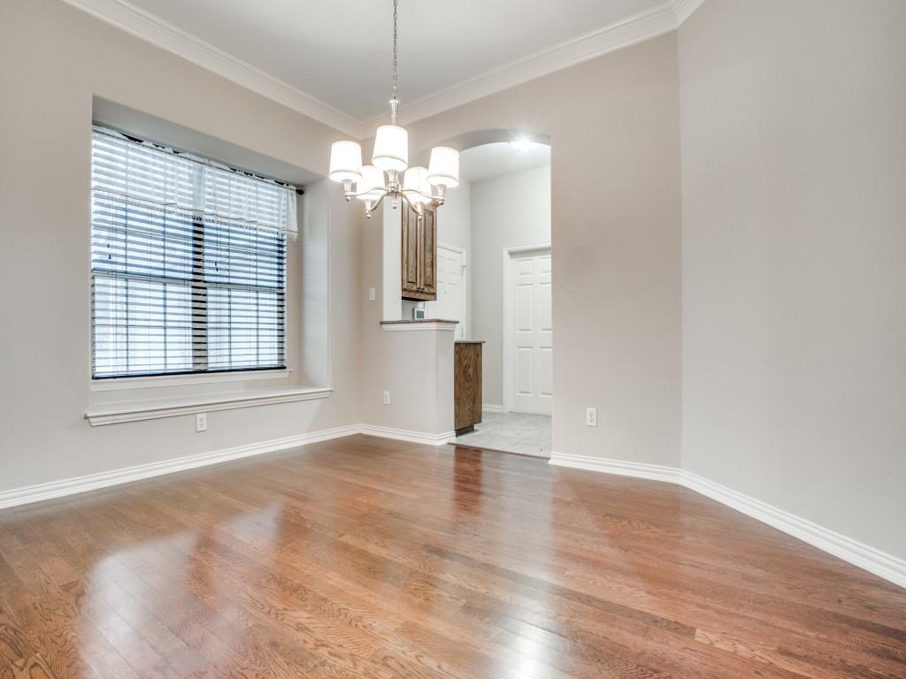 2613 Sandstone Lane Midlothian, TX 76065 - Photo 7 of 36 a view of an empty room with a window and wooden floor