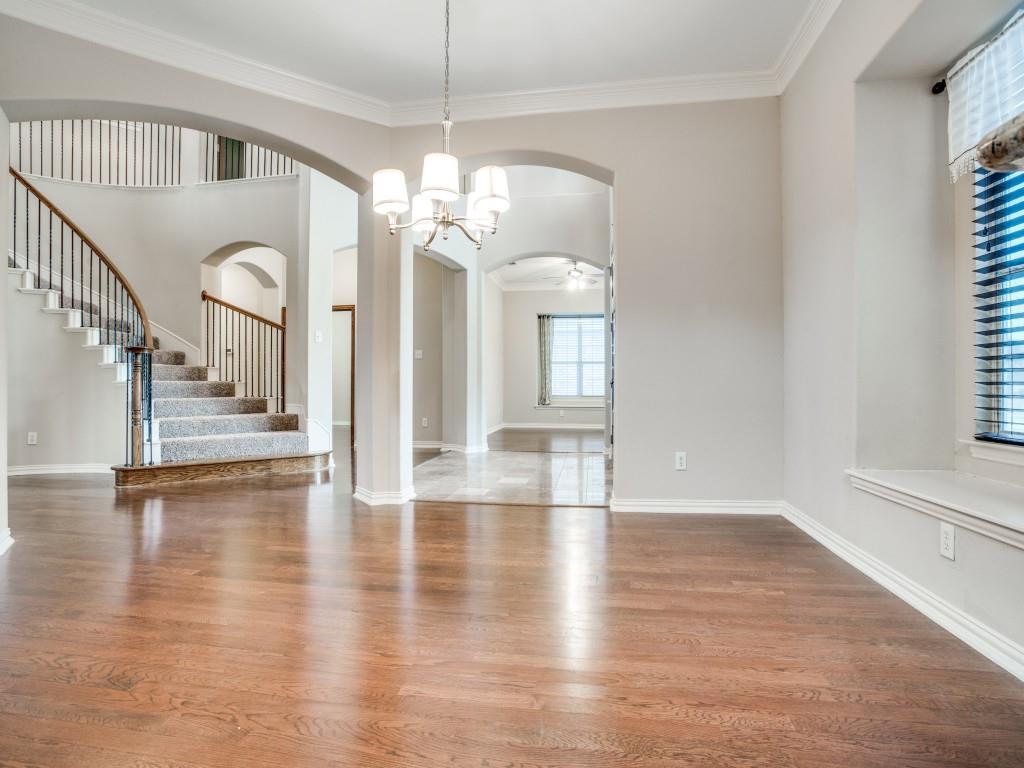 2613 Sandstone Lane Midlothian, TX 76065 - Photo 8 of 36 a view of a room with wooden floor chandelier and windows