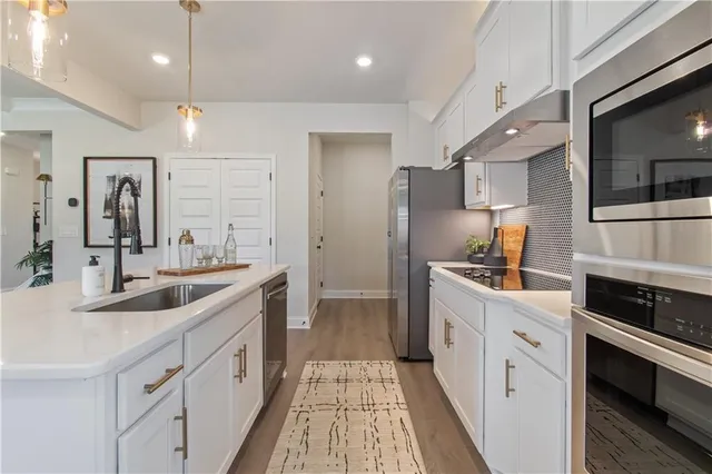 a view of a dining room with furniture and a window