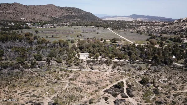 an aerial view of residential house and sandy dunes