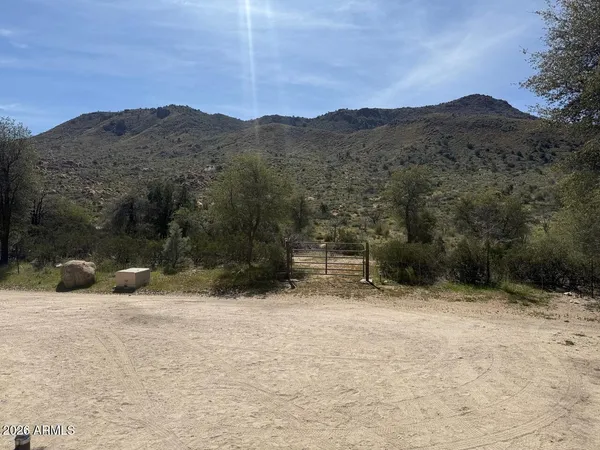 a view of a house with a snow in the background
