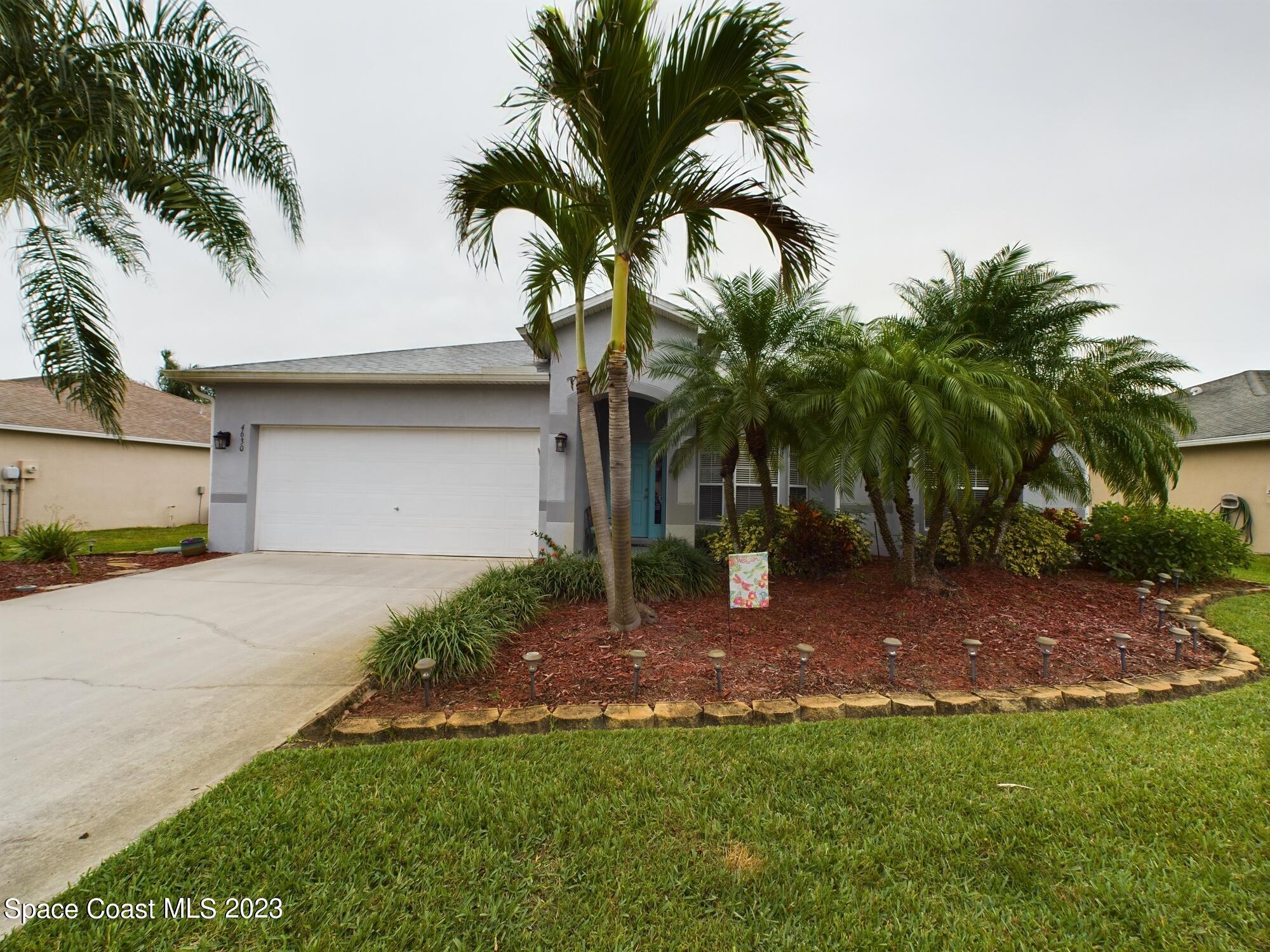 4630 Paladin Circle Vero Beach, FL 32967 - Photo 1 of 33 a view of a backyard with a palm tree