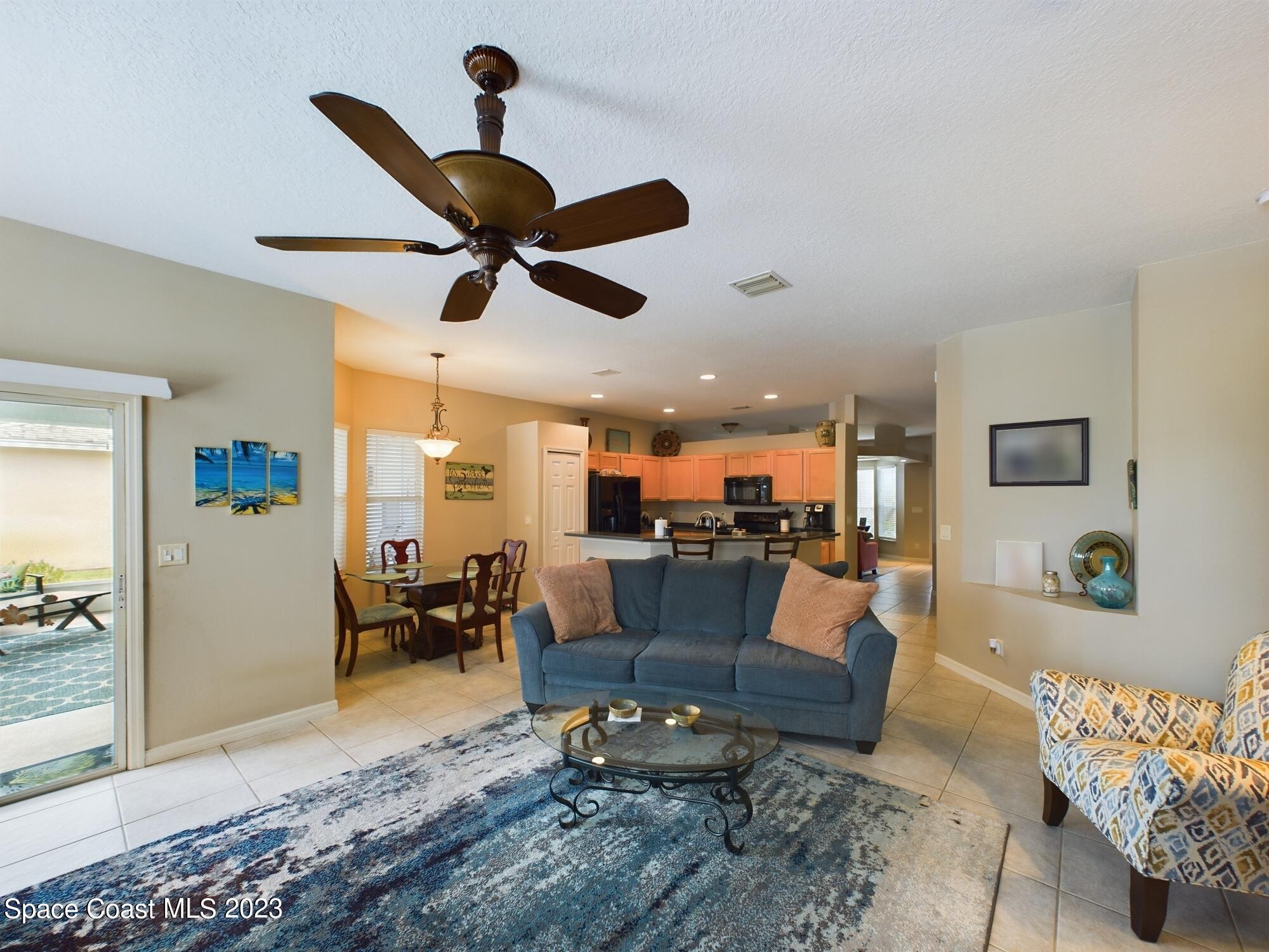 4630 Paladin Circle Vero Beach, FL 32967 - Photo 19 of 33 a living room with furniture and kitchen view