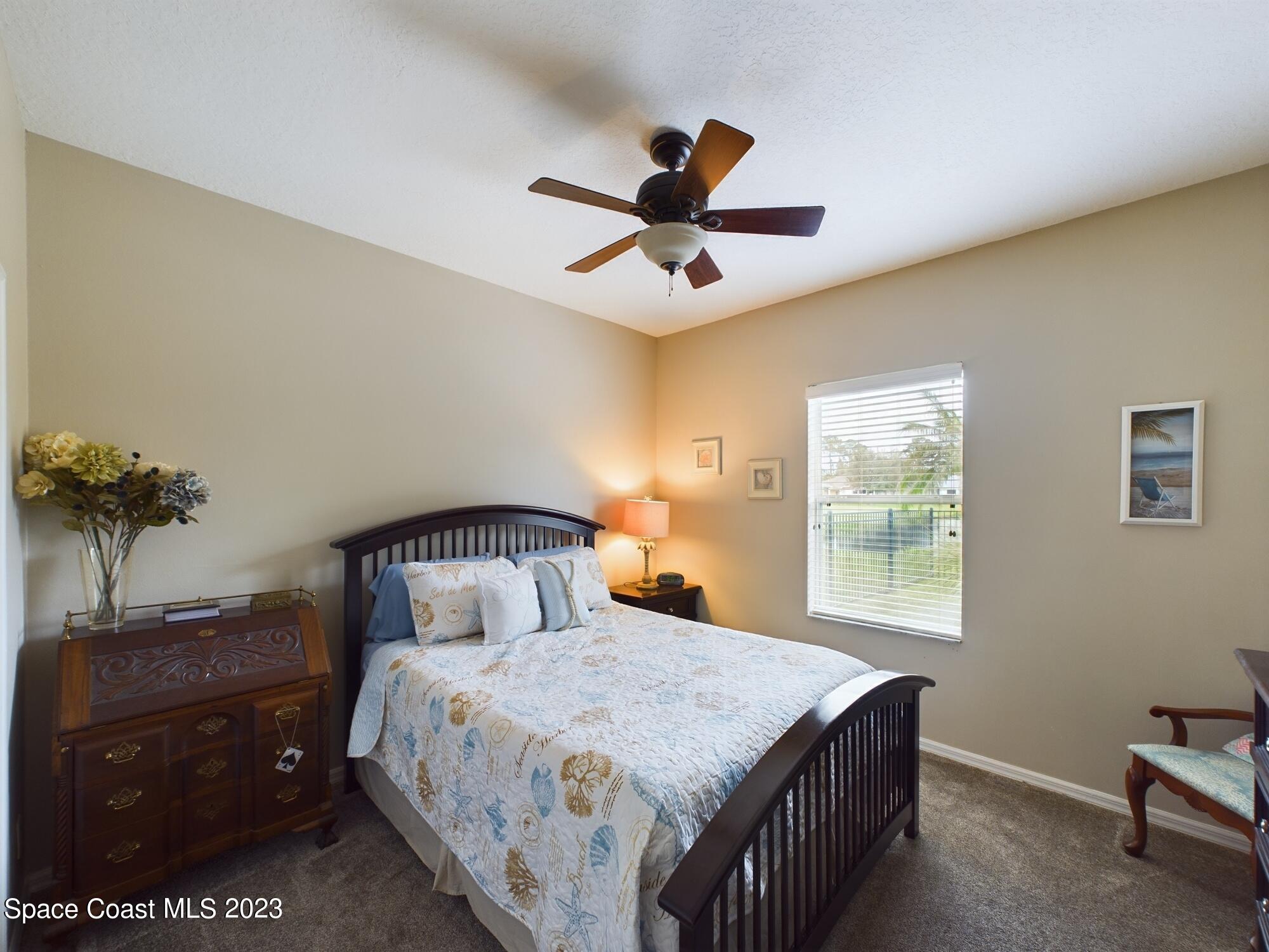 4630 Paladin Circle Vero Beach, FL 32967 - Photo 21 of 33 a bedroom with a bed and a window