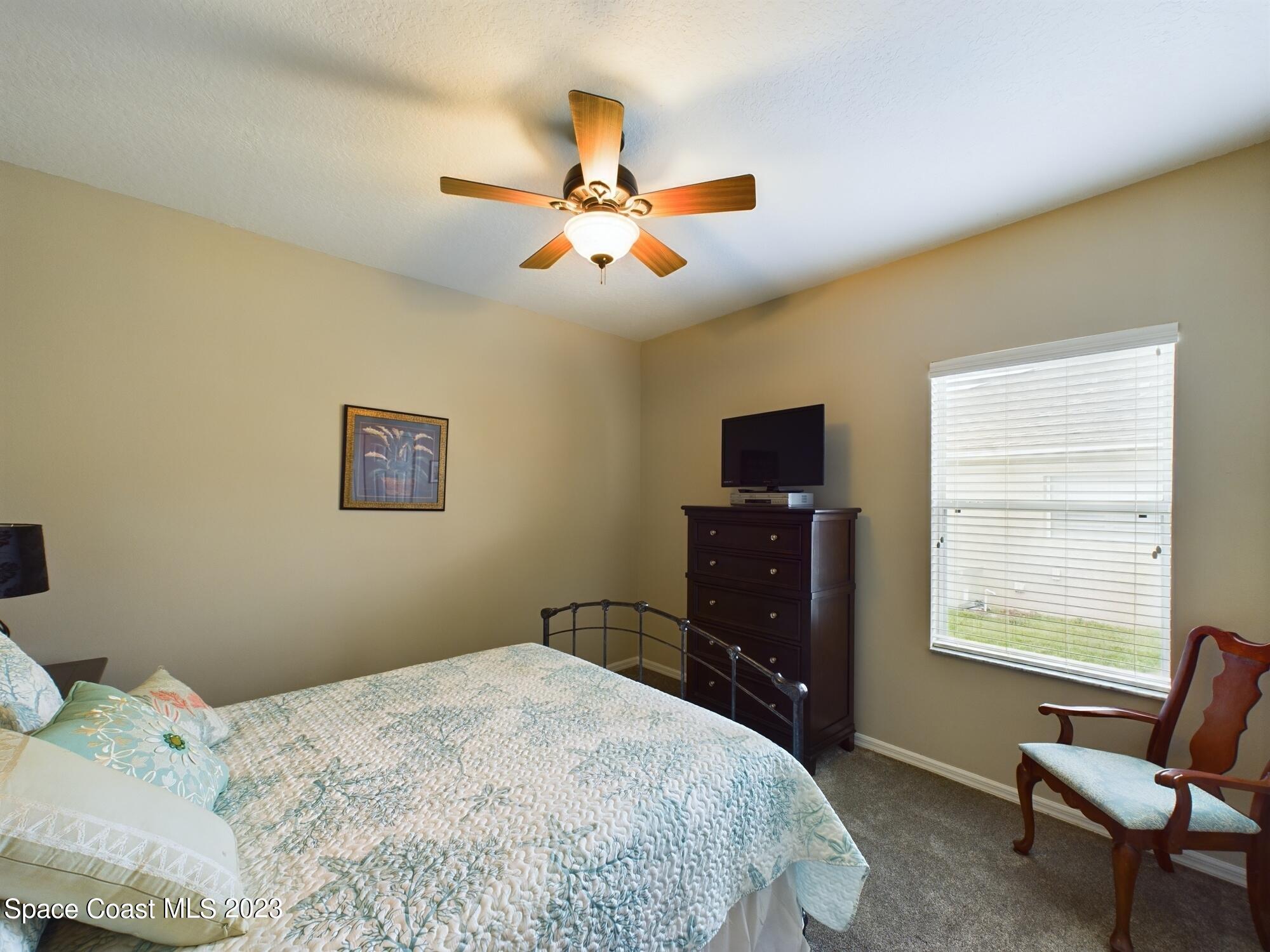 4630 Paladin Circle Vero Beach, FL 32967 - Photo 25 of 33 a bedroom with a bed and a window