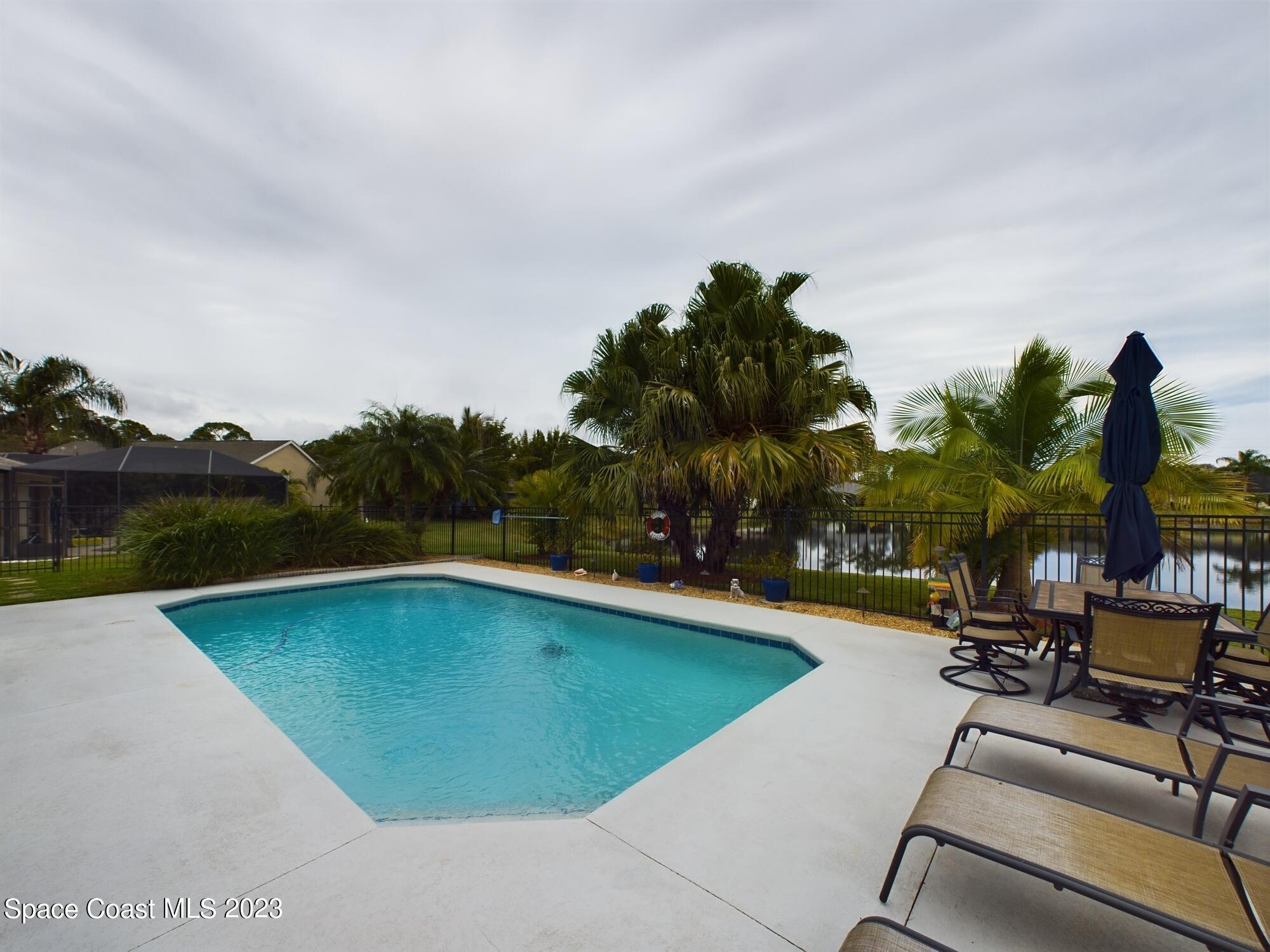 4630 Paladin Circle Vero Beach, FL 32967 - Photo 30 of 33 a view of swimming pool with outdoor seating and plants