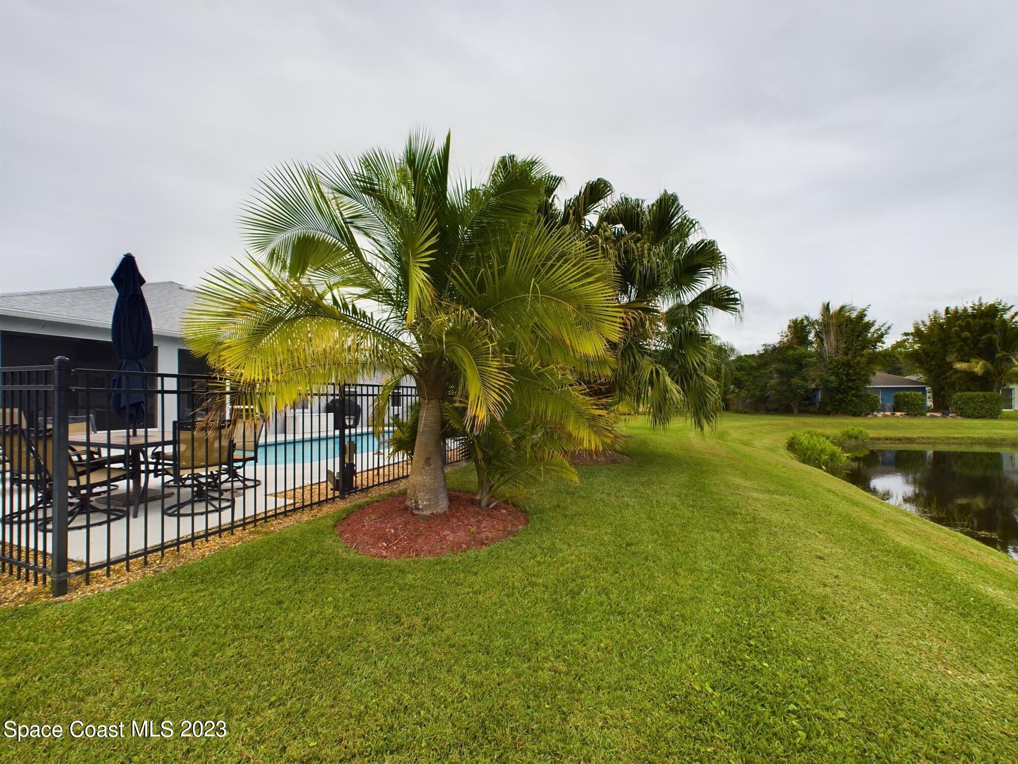 4630 Paladin Circle Vero Beach, FL 32967 - Photo 33 of 33 a view of swimming pool from a garden