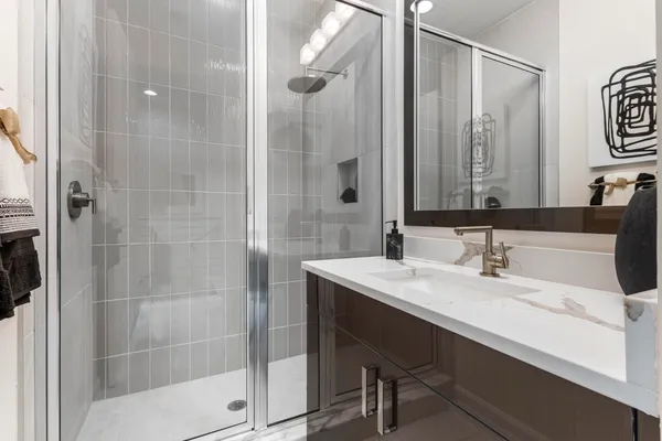 a bathroom with a sink and a mirror