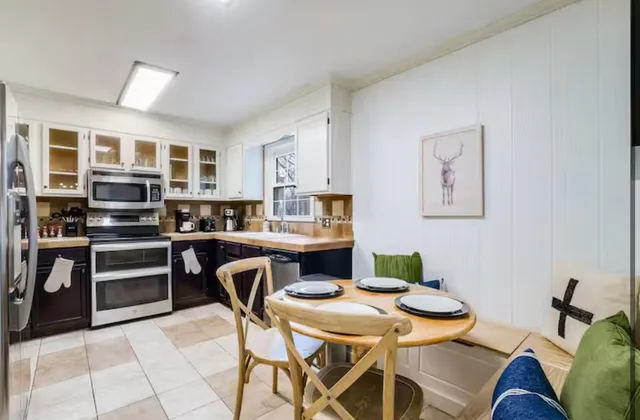 a bedroom with a bed and a television