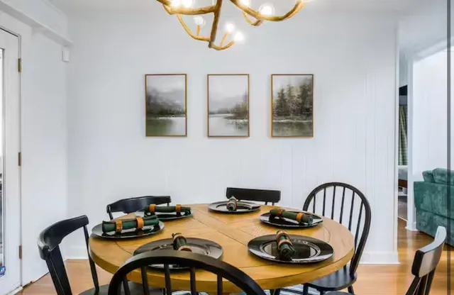 a bedroom with a bed a mirror and a window