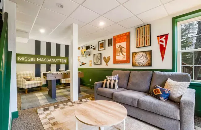 a backyard of a house with fountain table and chairs