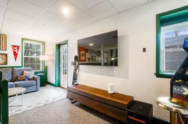 a view of a chairs and table in the back yard of the house