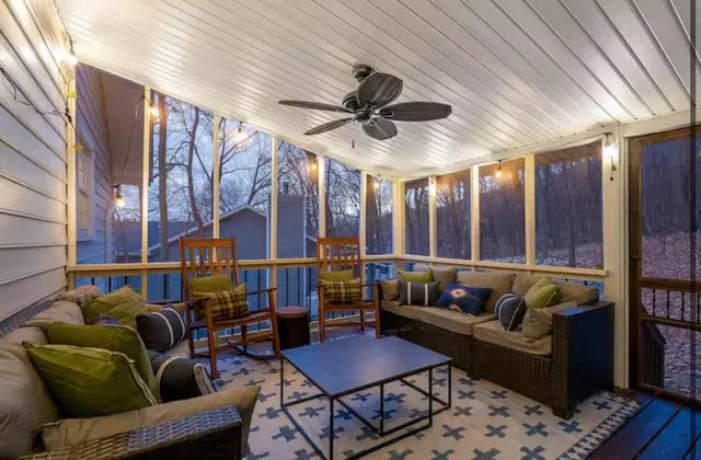a view of a house with a yard and sitting area