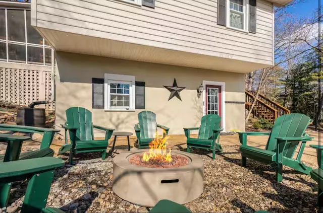 a living room with furniture fireplace and a flat screen tv