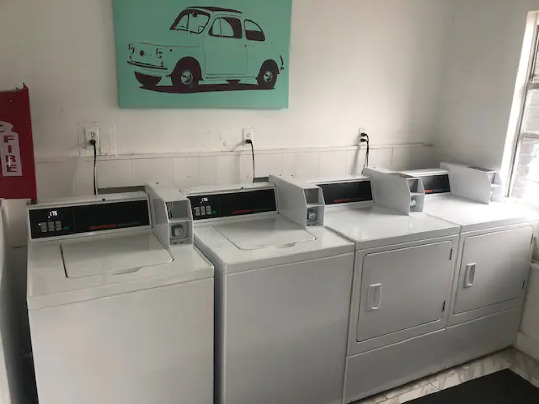 5909 Bolm Road, Unit 2 Austin, TX 78721 - Photo 8 of 10 Communal laundry room featuring washer and clothes dryer