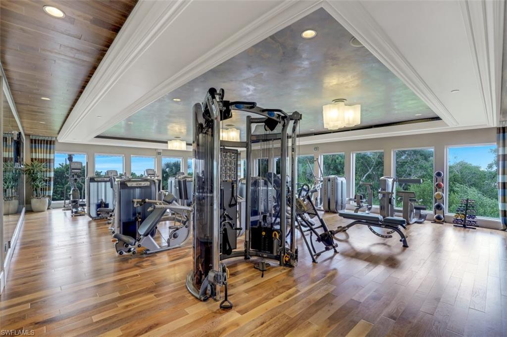 10 Seagate Drive, Unit 6S Naples, FL 34103 - Photo 33 of 34 a view of a room with gym equipment