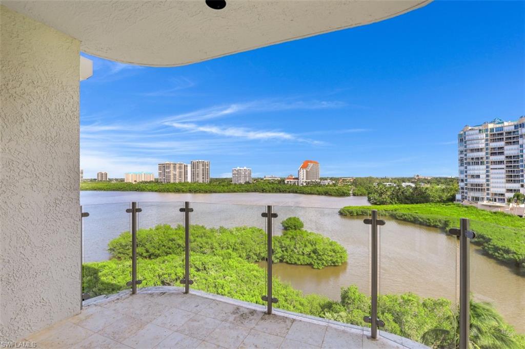 10 Seagate Drive, Unit 6S Naples, FL 34103 - Photo 5 of 34 a view of a lake with a big yard