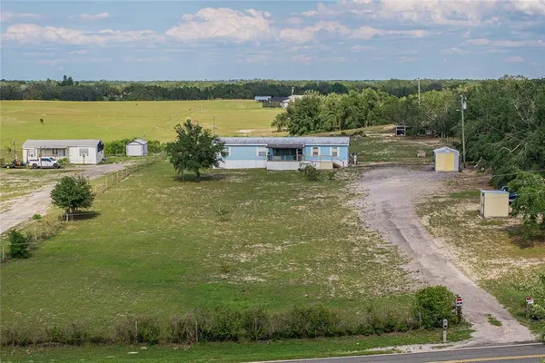 a view of a lake with a yard