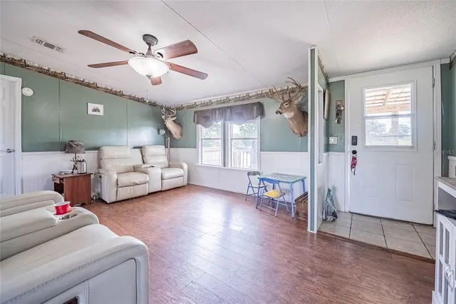 a view of a livingroom with furniture and a window