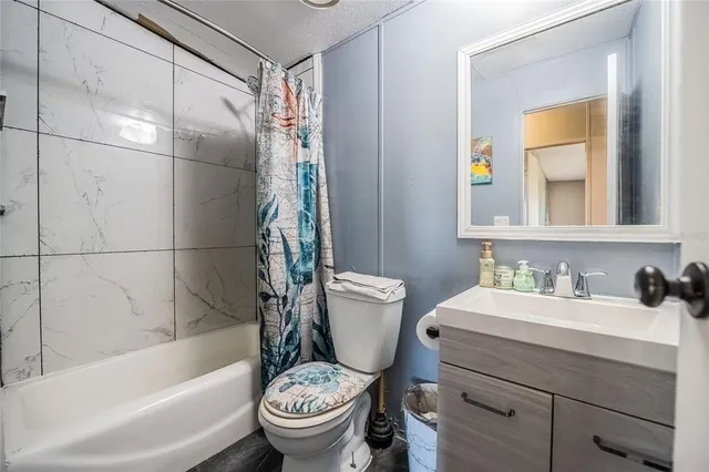 a bathroom with a sink toilet and a mirror