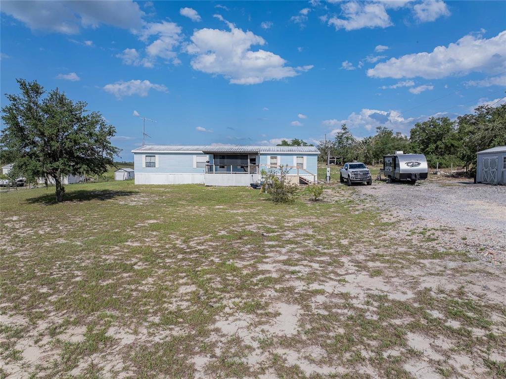 194 North Lake Patrick Road Babson Park, FL 33827 - Photo 27 of 31 a view of a house with a yard