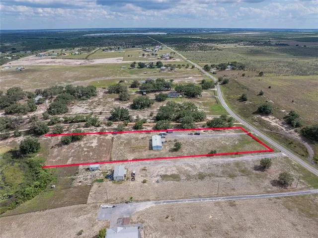 an aerial view of beach and ocean