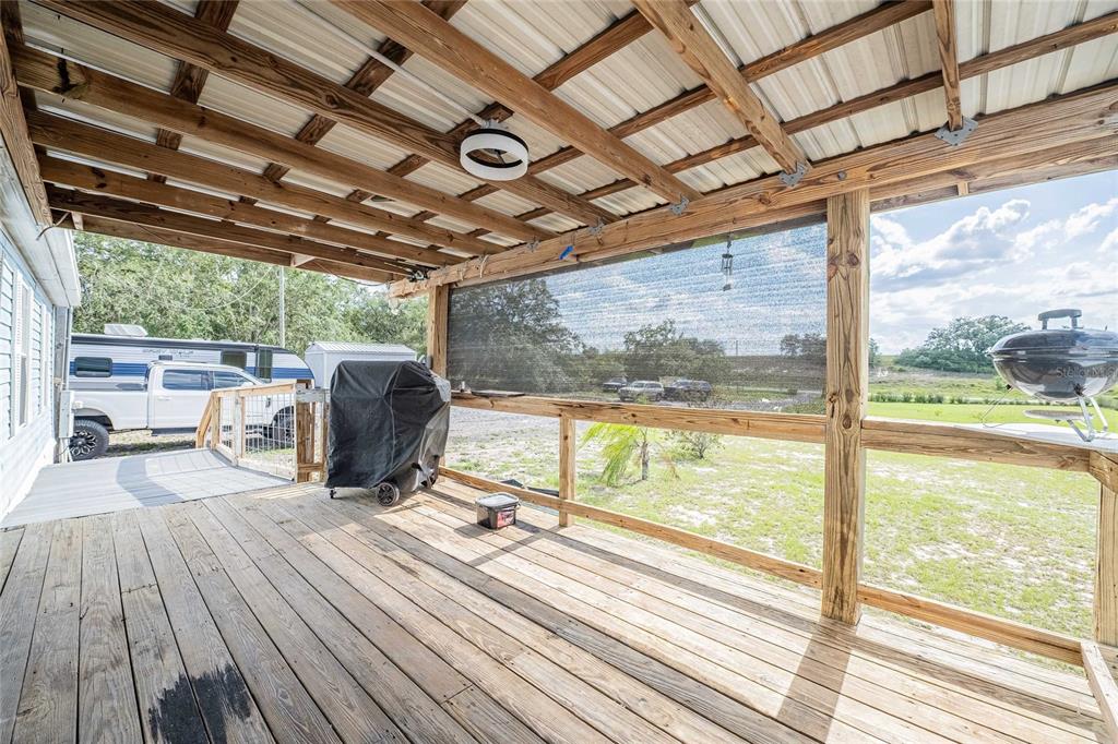 194 North Lake Patrick Road Babson Park, FL 33827 - Photo 31 of 31 a view of a room with wooden floor and iron stairs