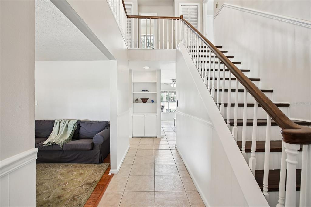 19254 Blount Road Lutz, FL 33558 - Photo 13 of 34 a living room with furniture and stairs