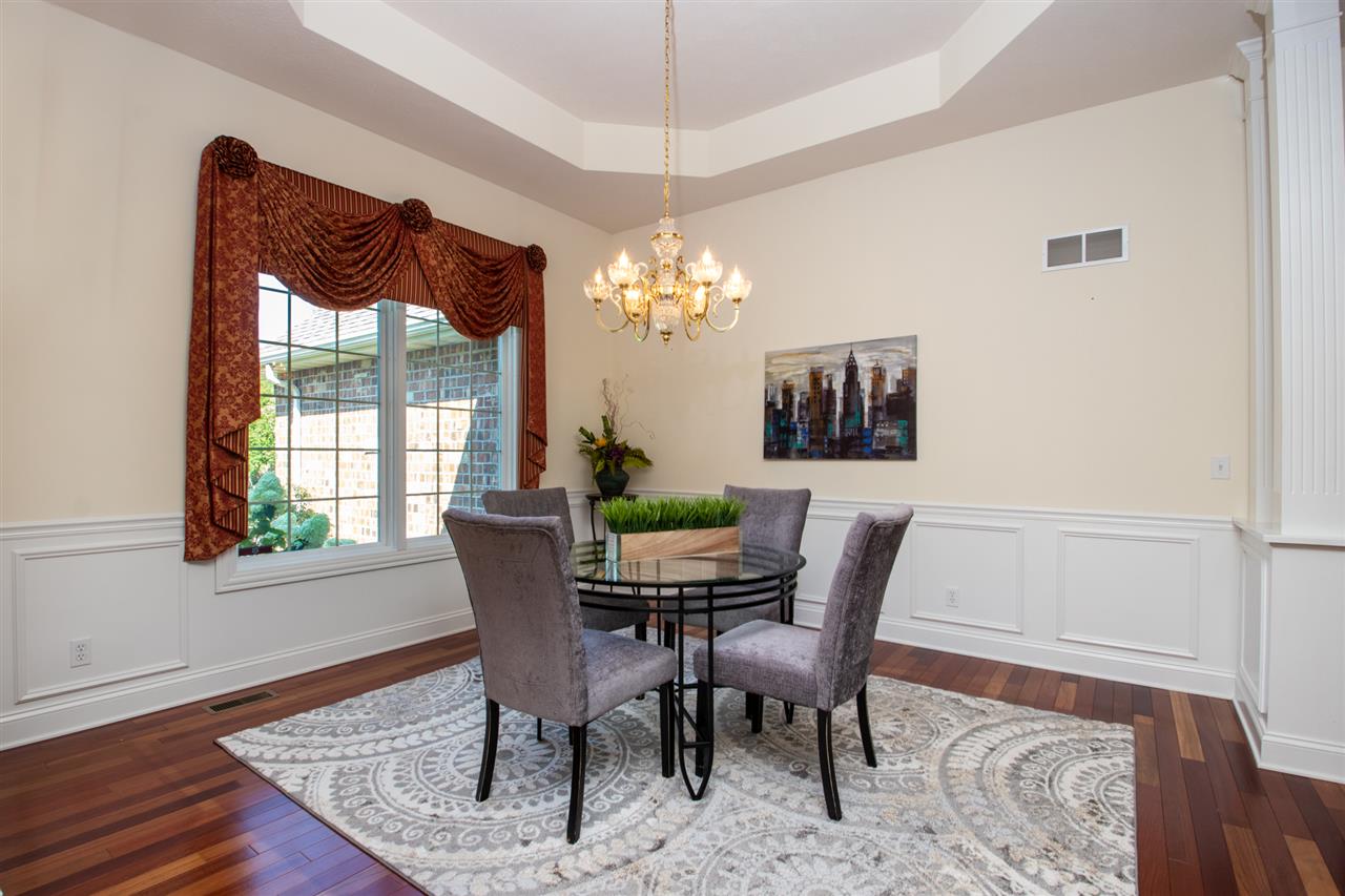 643 Roxbury Road Rockford, IL 61107 - Photo 4 of 25 a dining room with furniture a rug and a chandelier