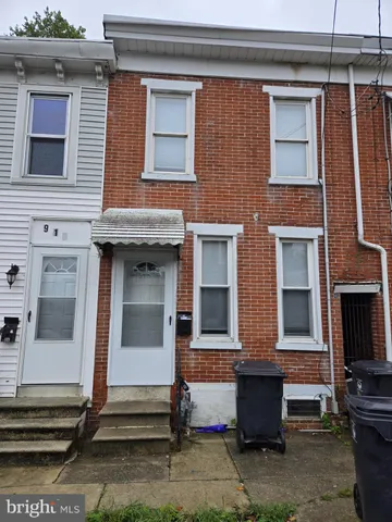a front view of a house with a garage