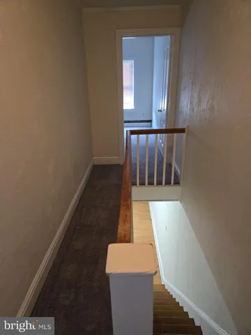 view of wooden floor and stairs