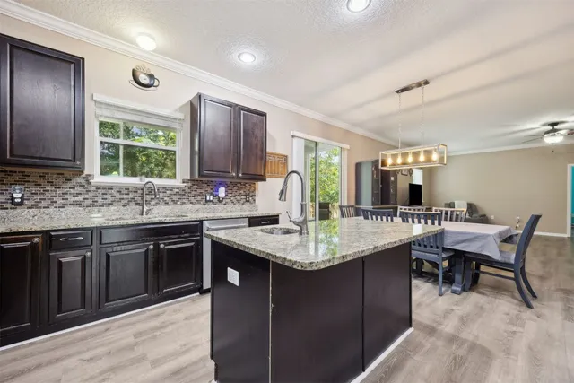 a bedroom with a bed and a ceiling fan