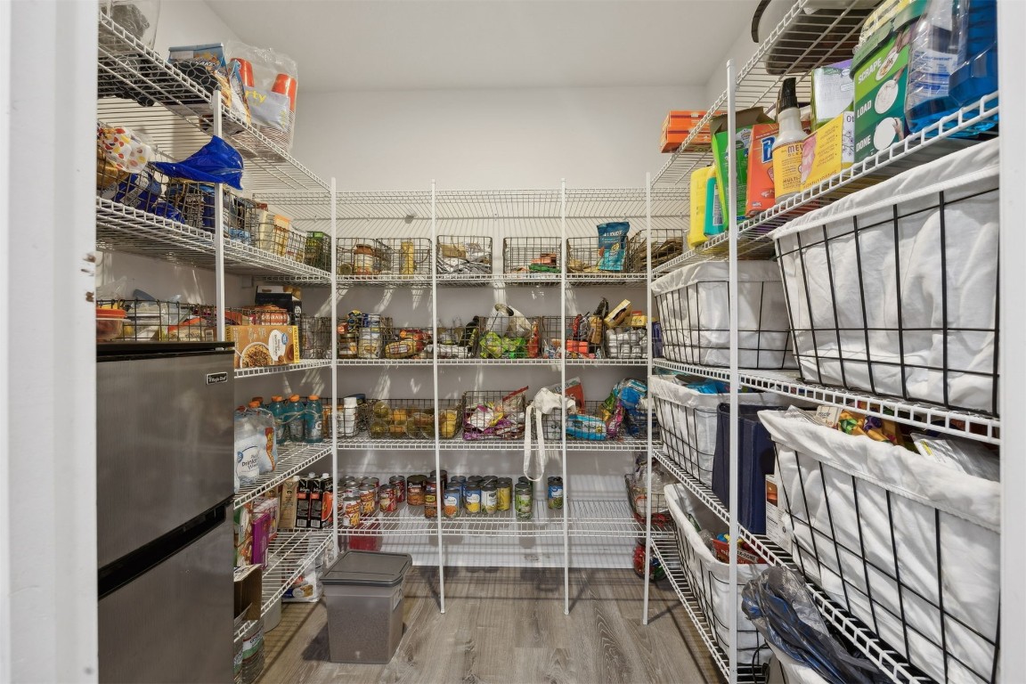 97042 Huntington Court Yulee, FL 32097 - Photo 15 of 54 a view of walk in closet with clothes and shoes