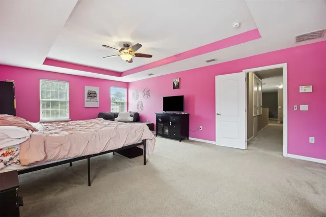 a en suite bathroom with a sink vanity and a mirror
