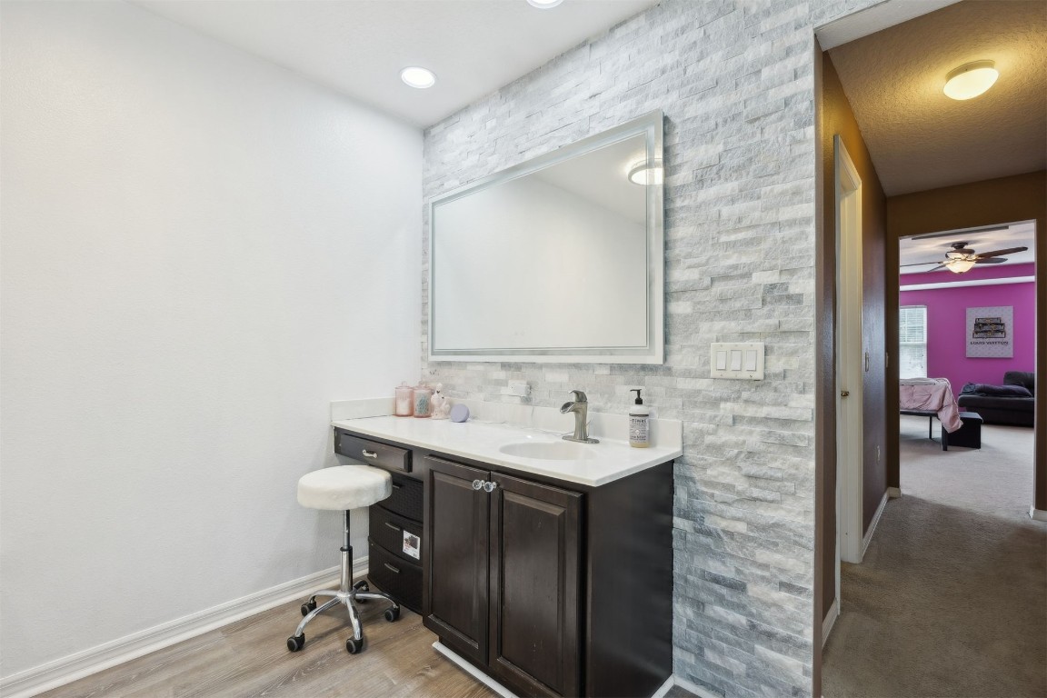 97042 Huntington Court Yulee, FL 32097 - Photo 20 of 54 a bathroom with a sink a toilet and mirror