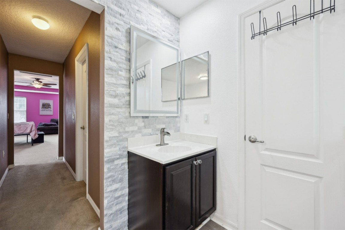 97042 Huntington Court Yulee, FL 32097 - Photo 21 of 54 a en suite bathroom with a sink vanity and a mirror