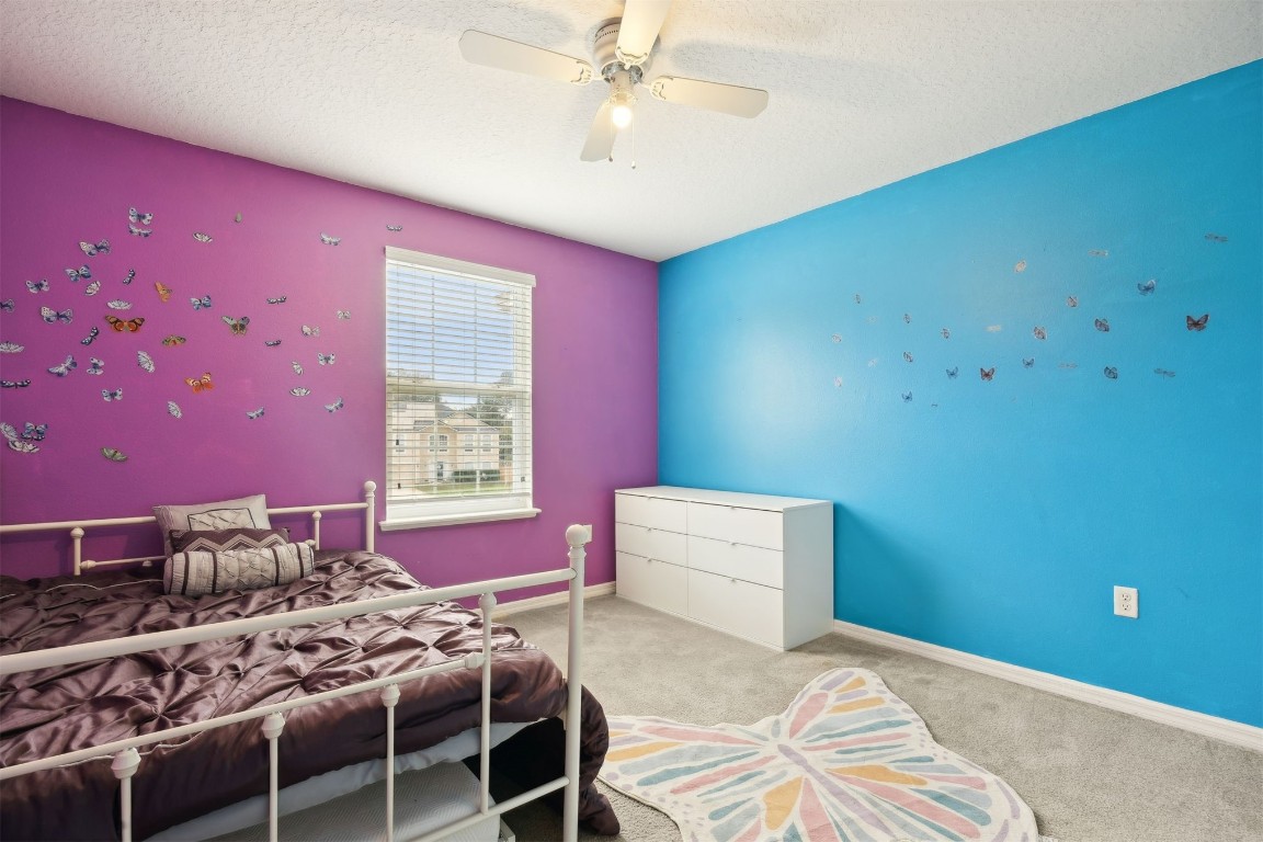 97042 Huntington Court Yulee, FL 32097 - Photo 25 of 54 a bedroom with a bed and a window