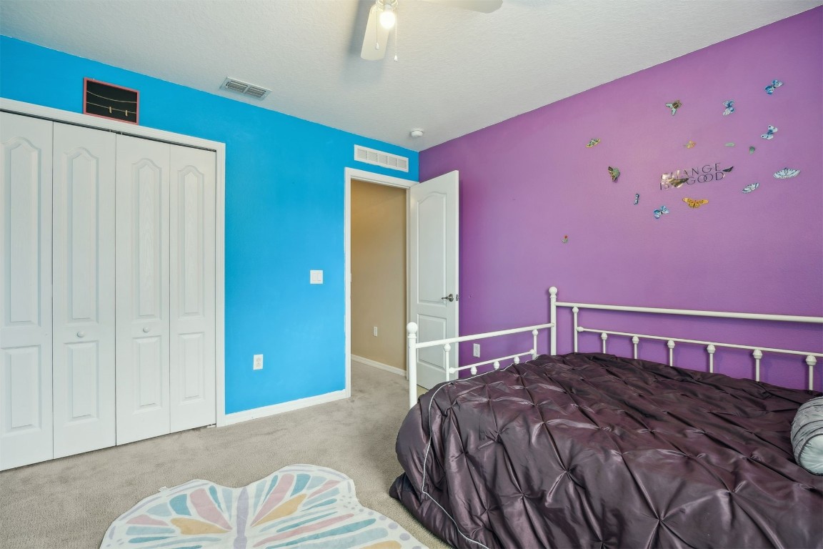 97042 Huntington Court Yulee, FL 32097 - Photo 26 of 54 a bedroom with a bed and a window