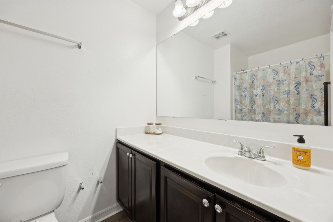 97042 Huntington Court Yulee, FL 32097 - Photo 37 of 54 a bathroom with a sink and a toilet