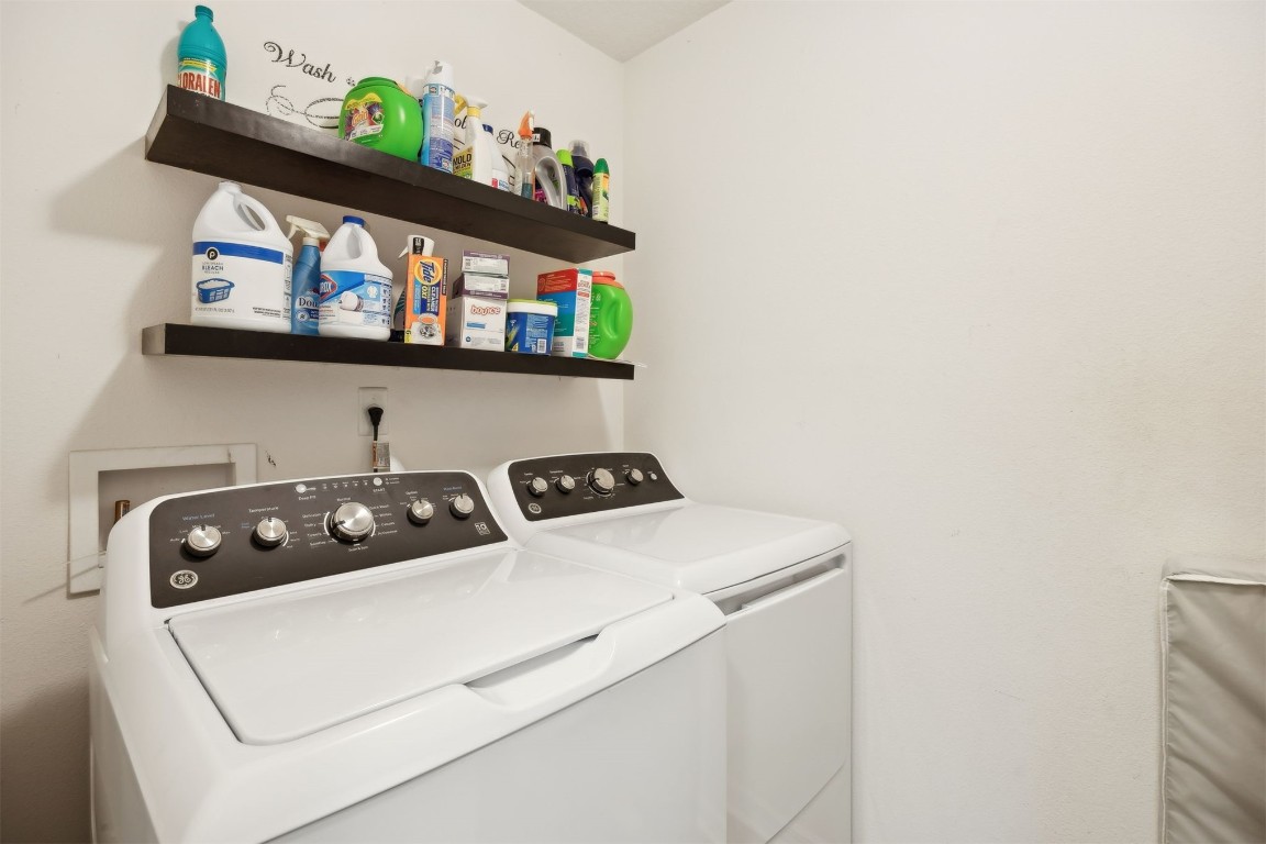 97042 Huntington Court Yulee, FL 32097 - Photo 38 of 54 a utility room with washer and dryer